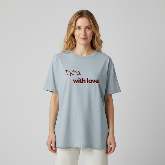 Trying, with love. Premium Oversized Unisex T-Shirt. - Love’s the effort. Not the reward.